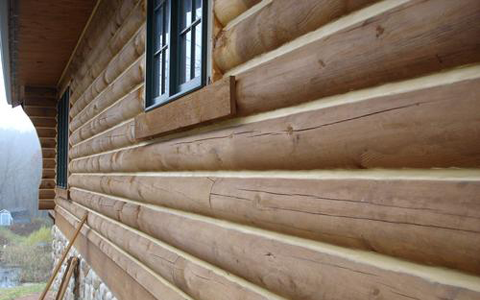 Log home restoration showing energy sealing and chinking log home florida